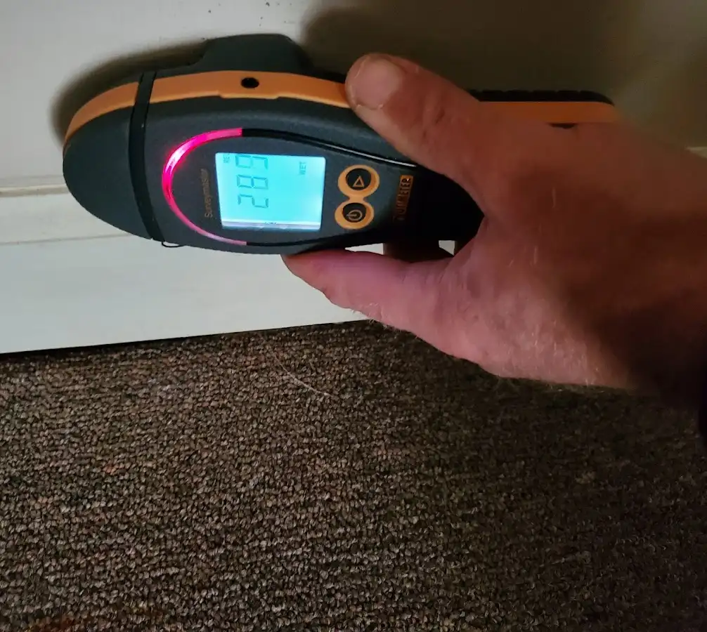 Moisture detection at baseboard during Storm Damage Restoration in Hammonton